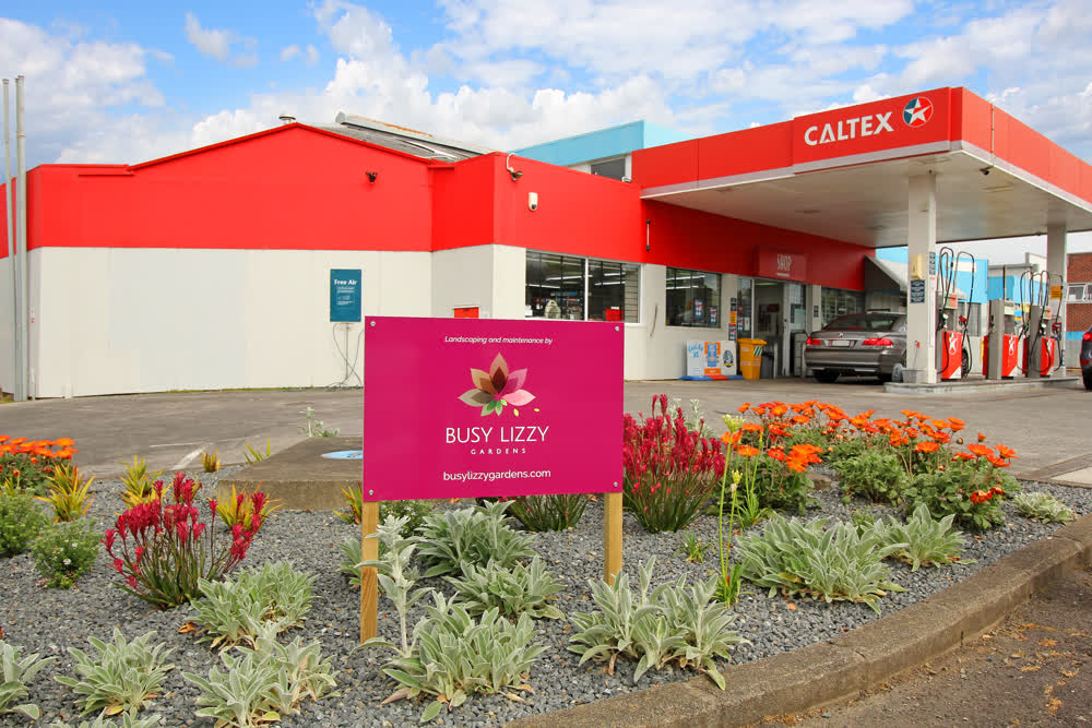 Berm garden bed with rock base at gas station